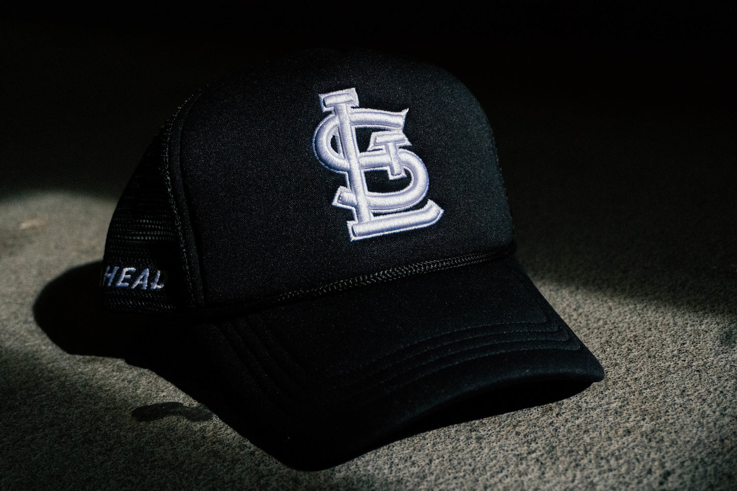 Black STL Trucker Hat